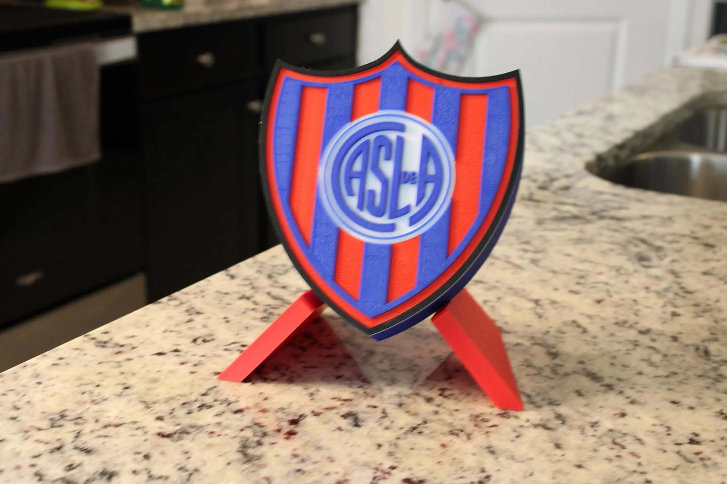 3D printed San Lorenzo emblem showcasing vibrant colors and unique design, perfect for fans of soccer and baseball.