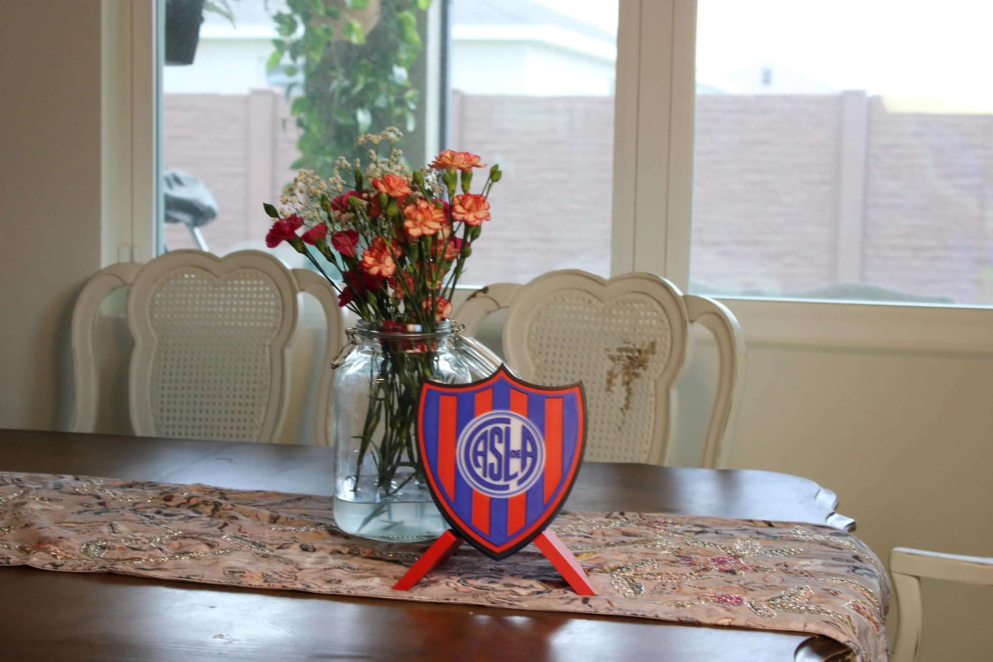 San Lorenzo 3D Printed Emblem displayed on a table, showcasing vibrant colors and unique design for true fans.