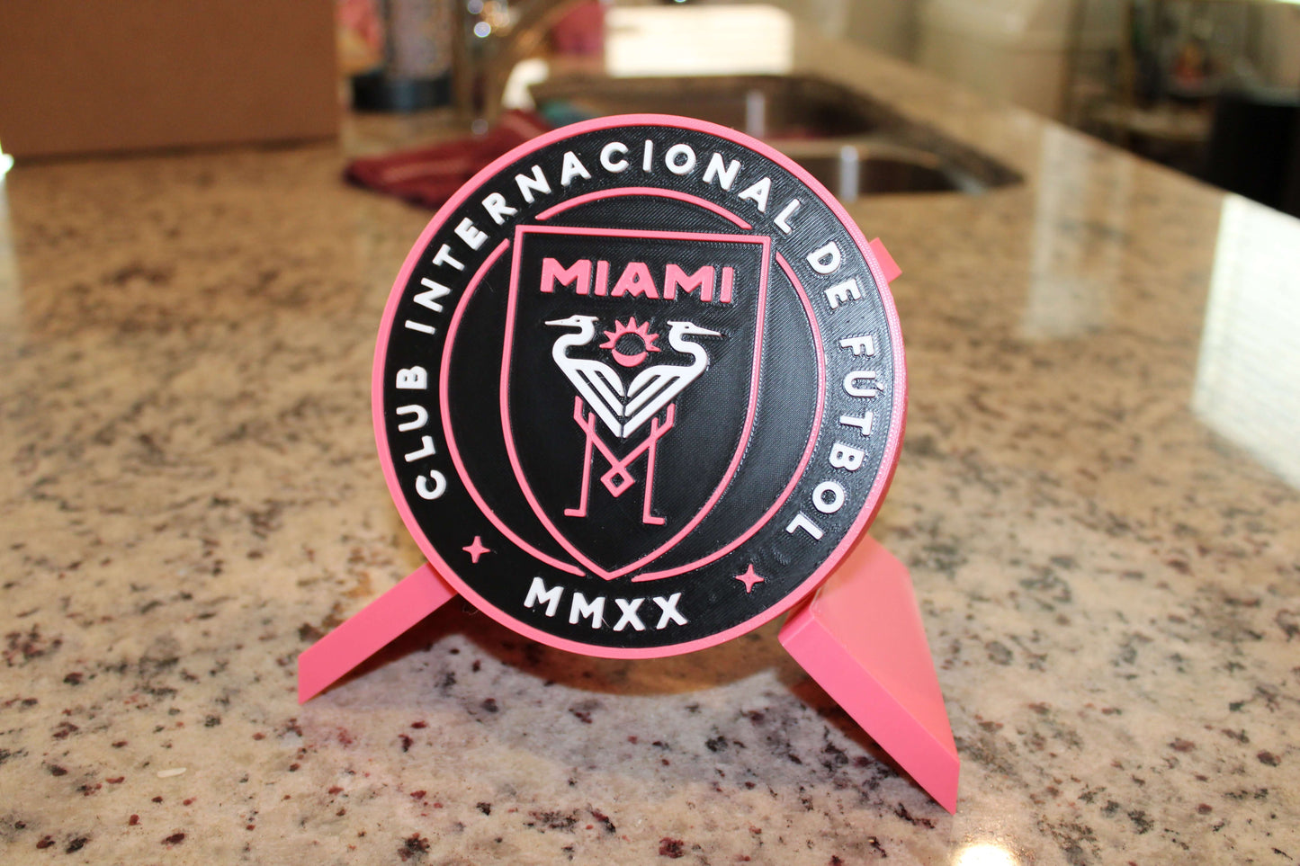Stylish Inter Miami 3D Printed Emblem on a countertop, showcasing vibrant colors and high-quality design for soccer fans.