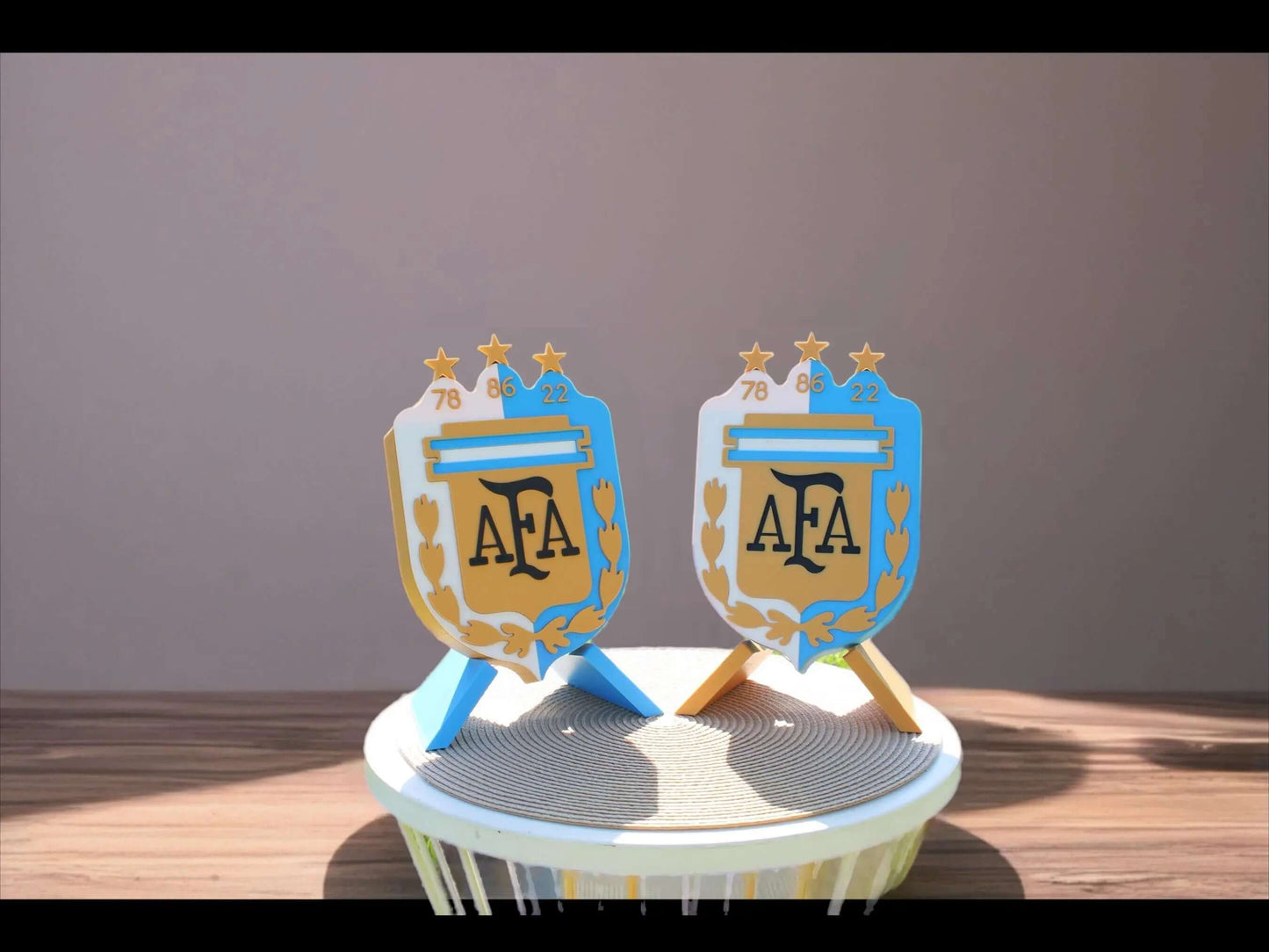 3D printed Argentina emblem honoring World Cup titles, vibrant colors, no assembly required, perfect for fans.