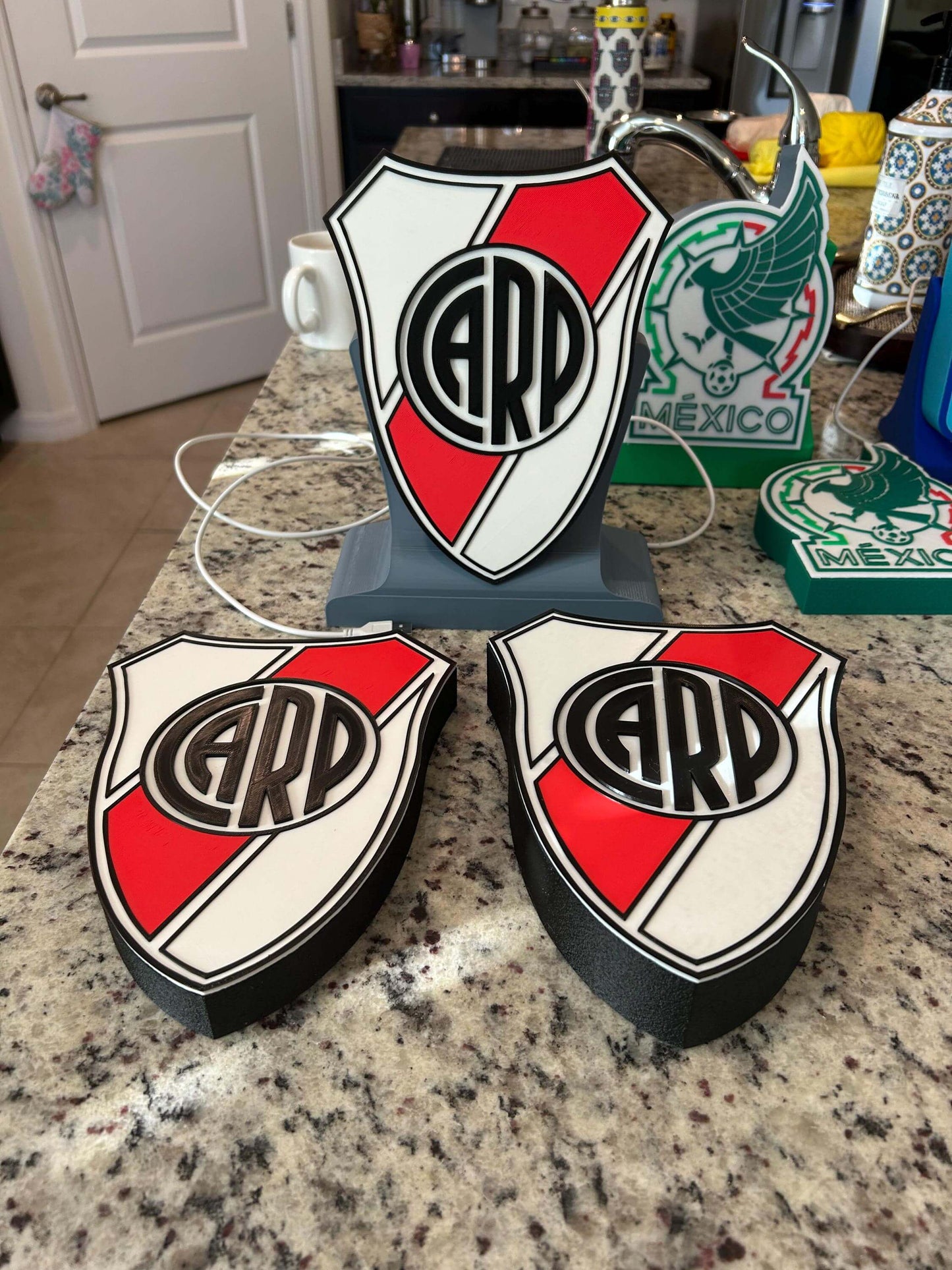 River Plate 3D printed soccer plaques in vibrant colors, perfect desk decor for fans and coaches, showcasing high-quality materials.