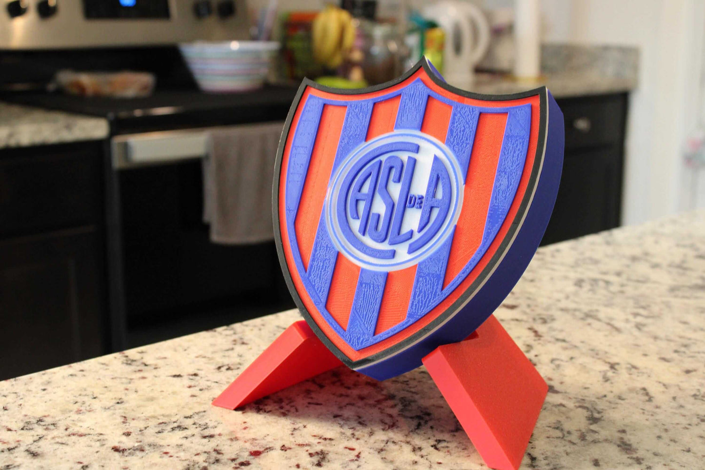 San Lorenzo 3D Printed Emblem on display, vibrant colors, no assembly or painting required, unique collectible for fans.