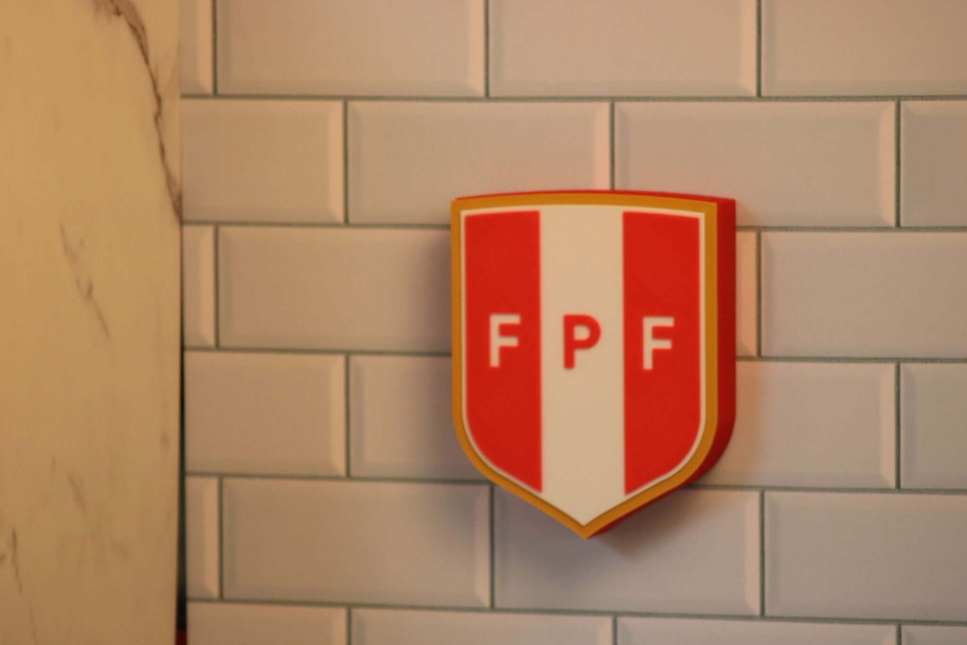 3D printed Peruvian Football Federation plaque, vibrant colors, unique piece for soccer fans, no assembly required.