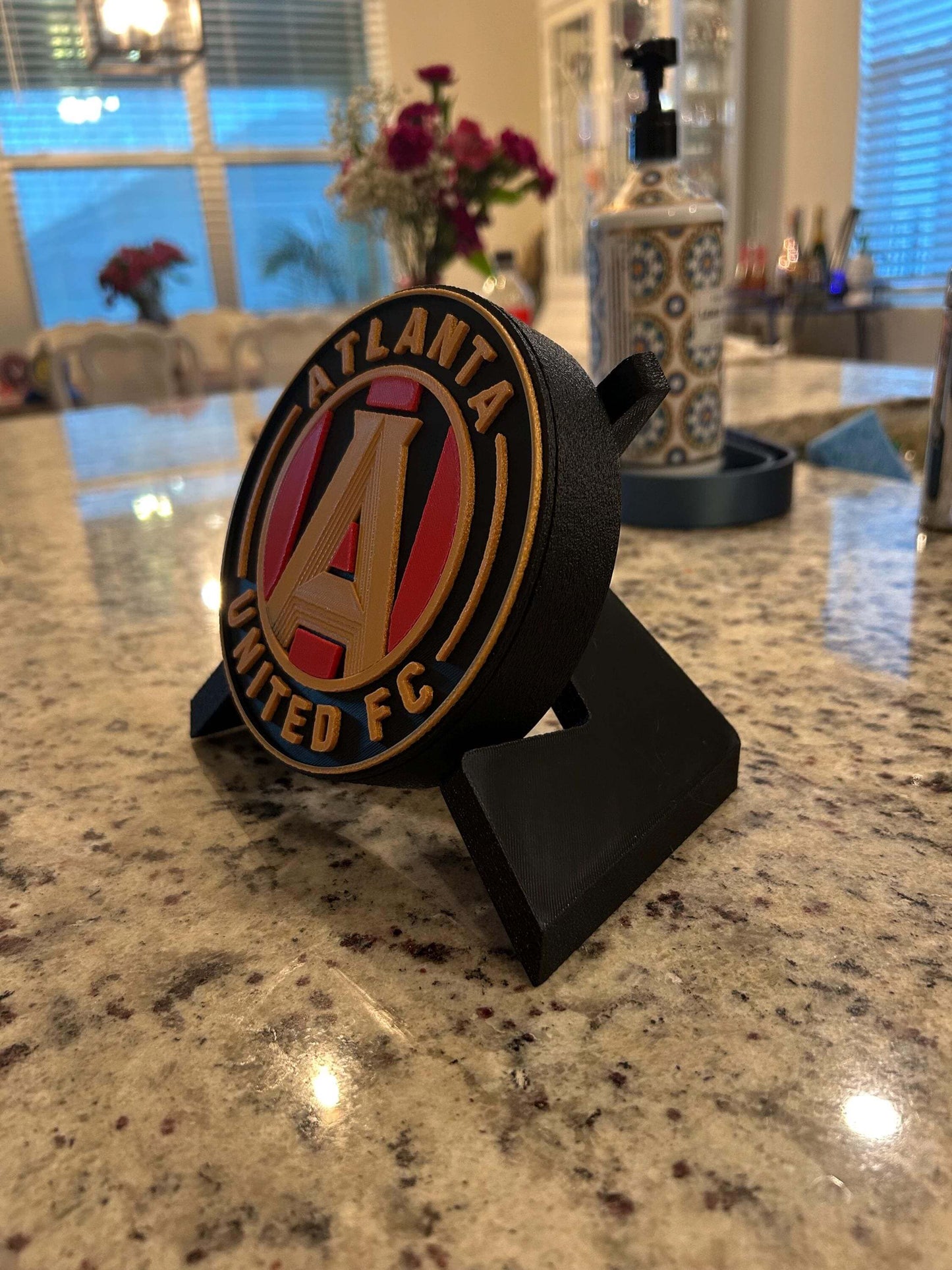 3D printed Atlanta United FC plaque on a countertop showcasing vibrant colors and unique design, perfect for any fan.