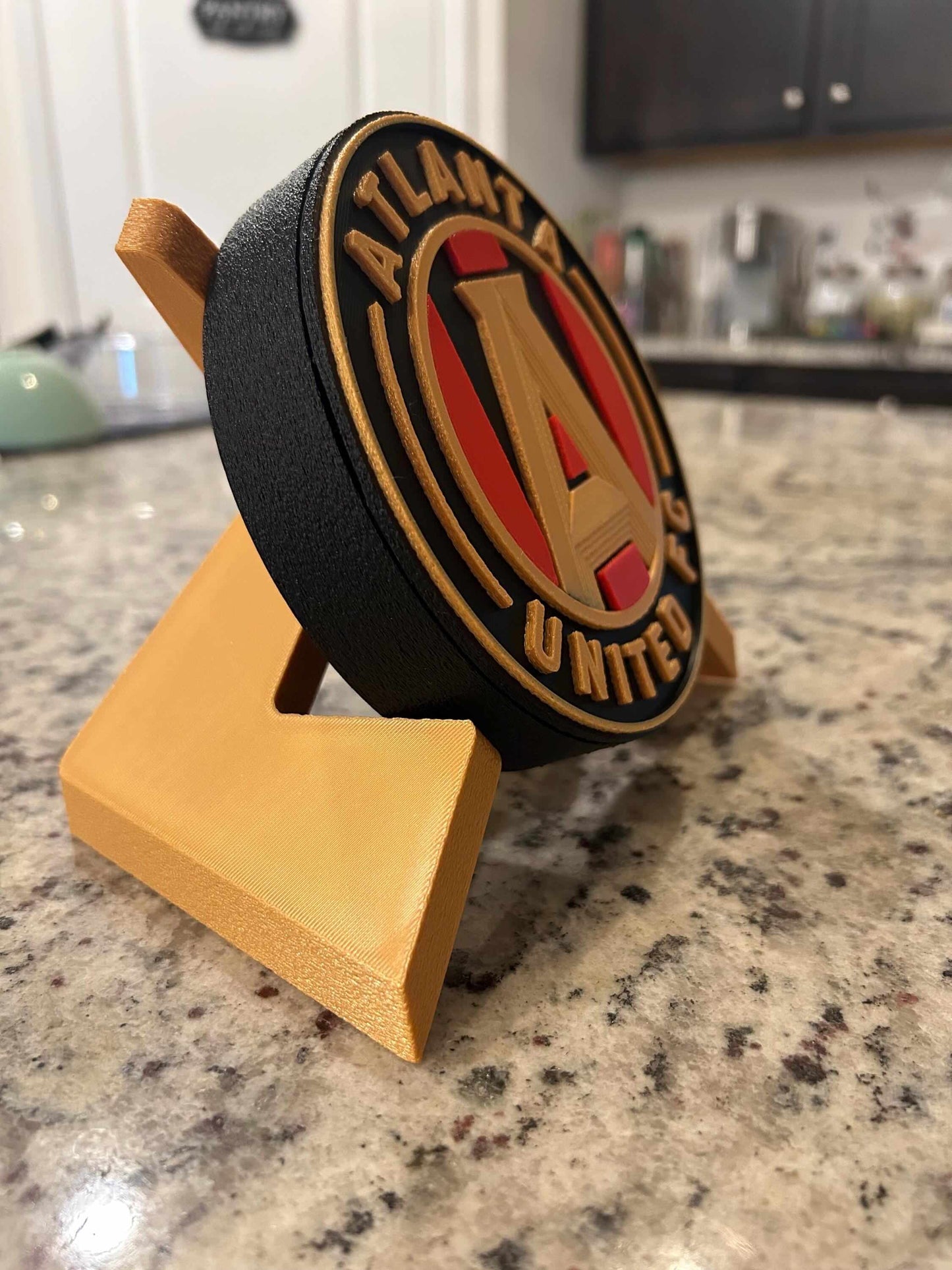 Atlanta United FC 3D printed plaque on display, featuring vibrant colors and iconic Five Stripes shield, handmade decor.