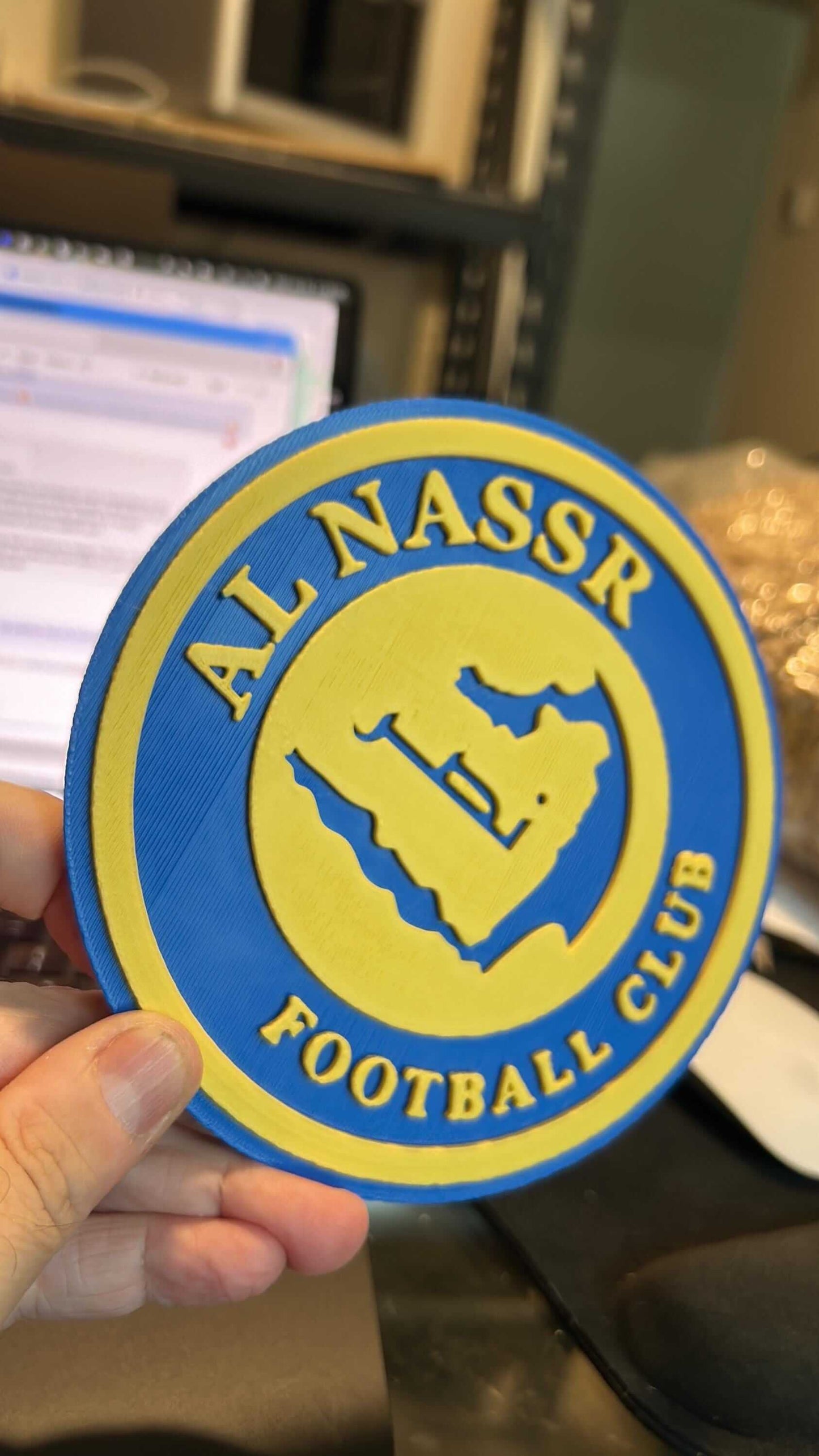 Al Nassr FC 3D printed plaque, vibrant yellow and blue design showcasing the club logo, perfect for fans.