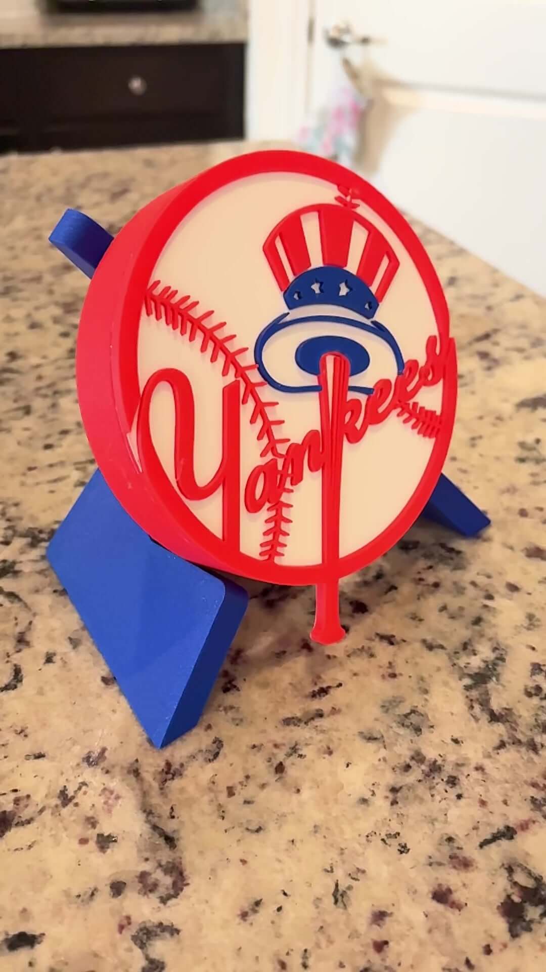 Customized New York Yankees 3D printed plaque on a countertop, showcasing vibrant colors and unique design.