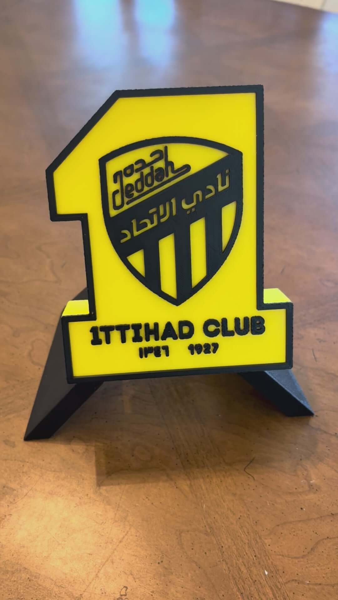 3D printed Al-Ittihad Club plaque, vibrant yellow and black decor, perfect for soccer fans, no assembly needed.
