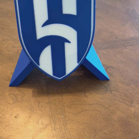 Al Hilal FC 3D printed plaque showcasing vibrant blue shield design, perfect for soccer fans and unique decor.